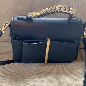 Cross body clutch bag black with gold chain and detail